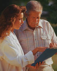 Picture of a female physician reviewing a chart with a patient