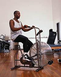 Picture of a man exercising on a stationary bicycle