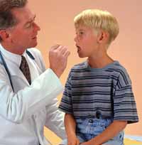 Picture of a physician examining a young boy