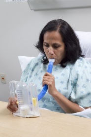 Photo of woman using a spirometer