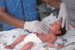Nurse checking newborn