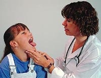 Picture of a female physician examining a young girl